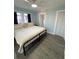 Main bedroom with king-size bed and ceiling fan at 222 27Th W St, Bradenton, FL 34205