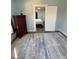 Bedroom with large area rug and view into another bedroom at 222 27Th W St, Bradenton, FL 34205