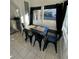 Dining area with black metal table and chairs near kitchen at 222 27Th W St, Bradenton, FL 34205