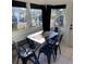 Bright dining area with black metal table and chairs at 222 27Th W St, Bradenton, FL 34205