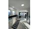 Modern kitchen with stainless steel appliances and white cabinets at 222 27Th W St, Bradenton, FL 34205