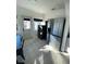 Kitchen features stainless steel appliances and laundry in unit at 222 27Th W St, Bradenton, FL 34205