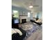 Bright living room with fireplace, comfy seating, and stylish rug at 222 27Th W St, Bradenton, FL 34205