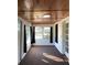 Bright sunroom with wood paneled ceiling and carpet at 222 27Th W St, Bradenton, FL 34205