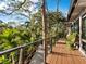 Relaxing deck overlooking lush greenery and a tranquil waterway at 2340 Arden Dr, Sarasota, FL 34232