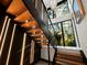 Modern floating staircase with wood steps and metal railing at 2340 Arden Dr, Sarasota, FL 34232