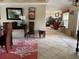 Open living room with tile floors and views into the kitchen at 247 Keel Way, Osprey, FL 34229