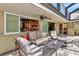 Patio with seating area and view of kitchen and pool at 247 Keel Way, Osprey, FL 34229