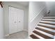 Clean stairwell with wood steps and white risers at 2905 Gulf Dr, Holmes Beach, FL 34217