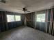 Renovation project bedroom with new flooring and windows at 3181 Irving St, Sarasota, FL 34237