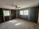 Large bedroom undergoing renovation with new window installation at 3181 Irving St, Sarasota, FL 34237