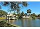 Community entrance with lake view and gazebo at 321 Lansbrook Dr, Venice, FL 34292