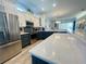 Modern kitchen featuring stainless steel appliances and expansive countertops at 321 Lansbrook Dr, Venice, FL 34292