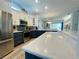 Modern kitchen featuring stainless steel appliances and expansive countertops at 321 Lansbrook Dr, Venice, FL 34292