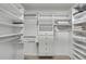 Large walk-in closet with ample shelving and drawers at 3235 Gulf Of Mexico Drive # A304, Longboat Key, FL 34228