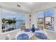 Bright dining area with water views and seating for four at 3320 Gulf Of Mexico Drive # 208C, Longboat Key, FL 34228