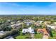 An aerial view showcasing the home's location within a residential neighborhood near the water at 348 Red Ash Cir, Englewood, FL 34223