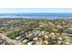 Birds-eye view of the home and surrounding neighborhood with waterfront views at 348 Red Ash Cir, Englewood, FL 34223