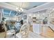 Elegant dining area adjacent to the kitchen, featuring a glass-top table and stylish light fixture at 348 Red Ash Cir, Englewood, FL 34223
