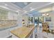 Spacious kitchen with large island, plenty of storage, and a view to the outdoors at 348 Red Ash Cir, Englewood, FL 34223