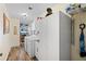 Laundry room with white cabinets, washer and dryer, and additional storage space at 348 Red Ash Cir, Englewood, FL 34223