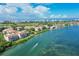 Breathtaking aerial view of waterfront condos and lush landscaping against a stunning coastal backdrop at 350 Gulf Of Mexico Dr # 211, Longboat Key, FL 34228