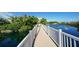 Scenic footbridge over a tranquil pond with a fountain at 350 Gulf Of Mexico Dr # 211, Longboat Key, FL 34228