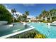 Community pool with cascading fountains, perfect for relaxation at 350 Gulf Of Mexico Dr # 211, Longboat Key, FL 34228