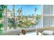 View from the window overlooking the beautiful pool area and tropical landscaping at 350 Gulf Of Mexico Dr # 211, Longboat Key, FL 34228