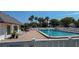 Inviting community pool with lounge chairs and shower at 3703 39Th W St, Bradenton, FL 34205