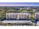 Aerial view of condo building showcasing its location and surrounding landscape at 3750 Pinebrook Cir # 404, Bradenton, FL 34209