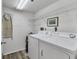 Laundry room with washer, dryer, and shelving at 3750 Pinebrook Cir # 404, Bradenton, FL 34209