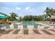 Inviting community pool with lounge chairs at 3750 Pinebrook Cir # 404, Bradenton, FL 34209