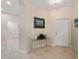 Bright and airy entryway with tile flooring and a console table at 4156 Cascade Falls Dr, Sarasota, FL 34243