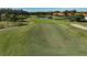 Golf course putting green with landscaping and pond at 4206 Caddie E Dr # 202, Bradenton, FL 34203