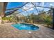 Enclosed pool and spa area with patio and seating at 4575 Scottish Ter, North Port, FL 34288