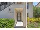 Condo entrance with walkway, landscaping, and building number at 4767 Winslow Beacon # 25, Sarasota, FL 34235