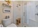 Shower with glass enclosure, built-in seat, and designer tile at 504 Woodstork Cir, Bradenton, FL 34209