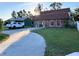 Charming exterior elevation with brick facade and mature landscaping at 5630 3Rd W St, Bradenton, FL 34207