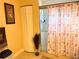 Shower with glass doors and decorative curtain, adjacent to closet at 5630 3Rd W St, Bradenton, FL 34207