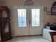 Front entrance with white double doors and glass panels at 5630 3Rd W St, Bradenton, FL 34207