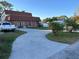 House exterior with driveway and palm trees at 5630 3Rd W St, Bradenton, FL 34207