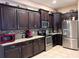 Spacious kitchen with dark wood cabinets and granite countertops at 5630 3Rd W St, Bradenton, FL 34207