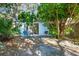 Peaceful backyard patio with seating area and grill, surrounded by trees at 608 N Jefferson Ave # 30, Sarasota, FL 34237
