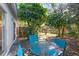 Private backyard with patio furniture and lush landscaping at 608 N Jefferson Ave # 30, Sarasota, FL 34237