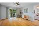 Bedroom with hardwood floors, built-in shelving, and patio access at 608 N Jefferson Ave # 30, Sarasota, FL 34237