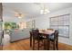 Bright dining area with wooden table and access to the living room at 608 N Jefferson Ave # 30, Sarasota, FL 34237