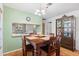 Dining area with wooden table and view into the kitchen at 608 N Jefferson Ave # 30, Sarasota, FL 34237