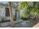 Front entrance with brick walkway and palm trees at 608 N Jefferson Ave # 30, Sarasota, FL 34237