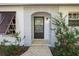 House entrance with arched entryway and brown door at 608 N Jefferson Ave # 30, Sarasota, FL 34237
